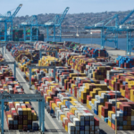 Import volumes at key West Coast ports surge amid labor strikes and global trade war fears.